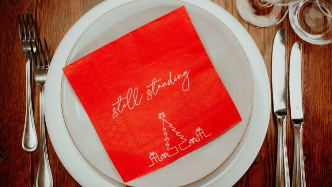 Weihnachtliche Papierserviette mit Schriftzug "still standing"